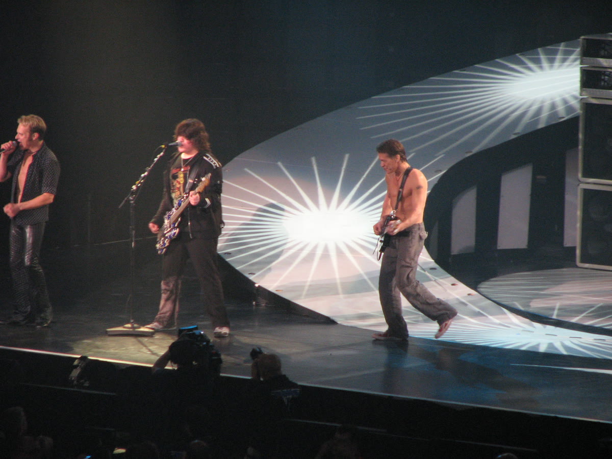 David Lee Roth, Wolfgang Van Halen, and Eddie Van Halen on stage